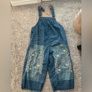 Embroidered denim capri overalls.